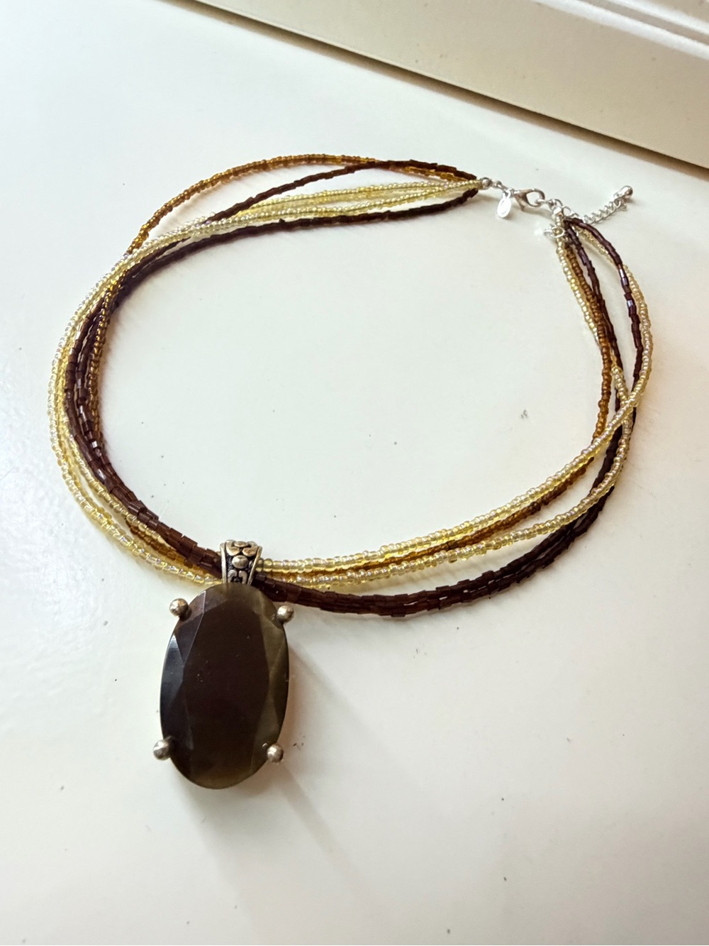 Brown and Gold Multi-Strand Beaded Necklace with Oval Pendant